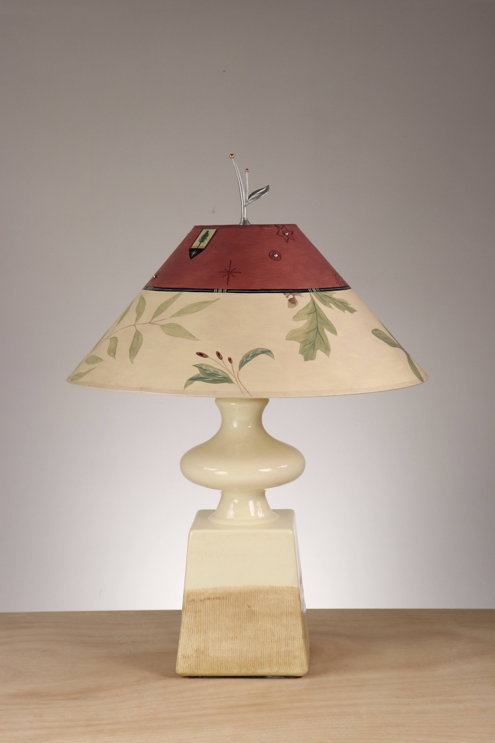 Janna Ugone & Co Ivory Ceramic Table Lamp with Large Conical Shade in Mixed Leaf in Bordeaux