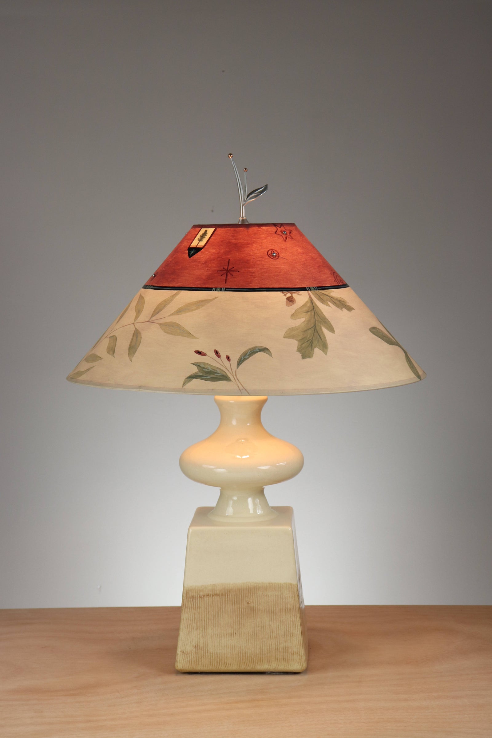 Janna Ugone & Co Ivory Ceramic Table Lamp with Large Conical Shade in Mixed Leaf in Bordeaux