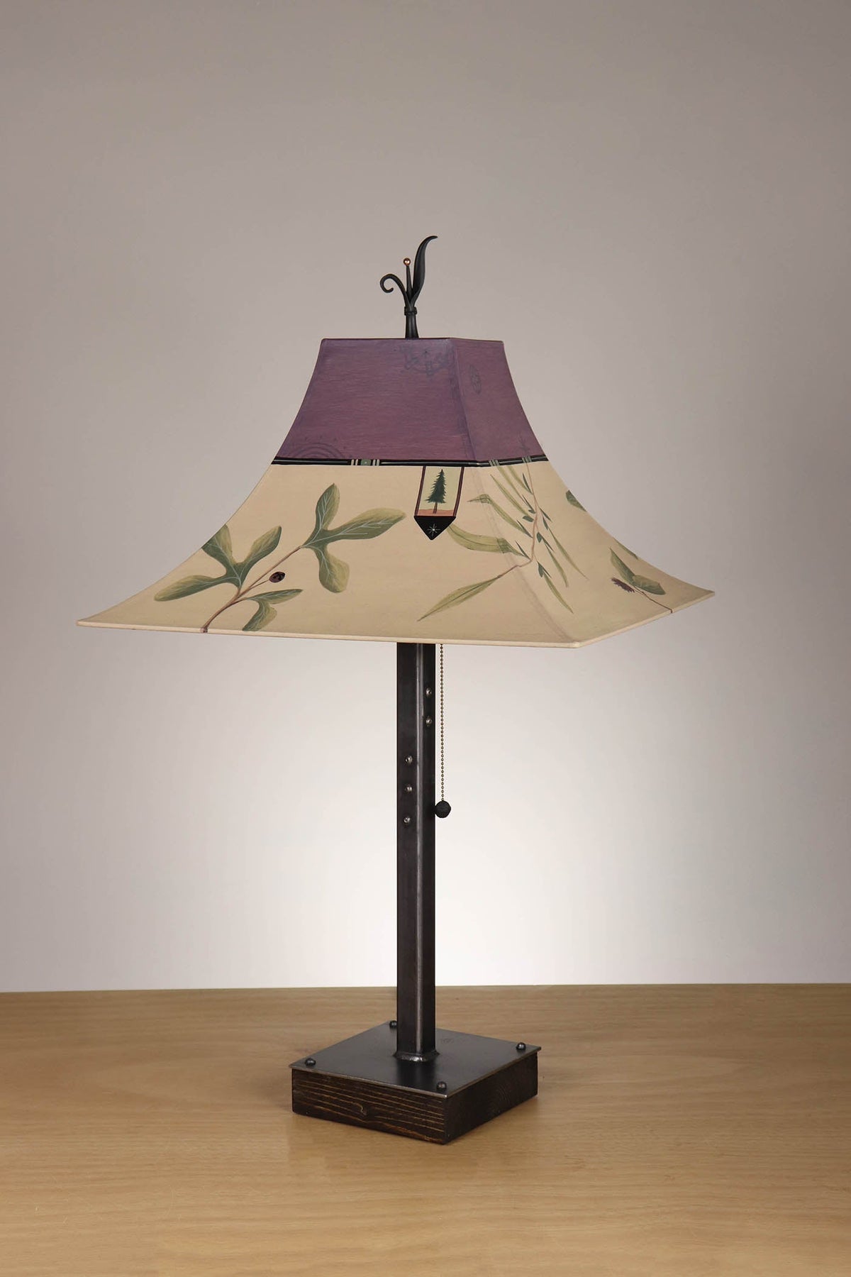 Janna Ugone &amp; Co Table Lamp Steel Table Lamp on Wood with Large Pagoda Shade in Mixed Leaves in Buff and Grape