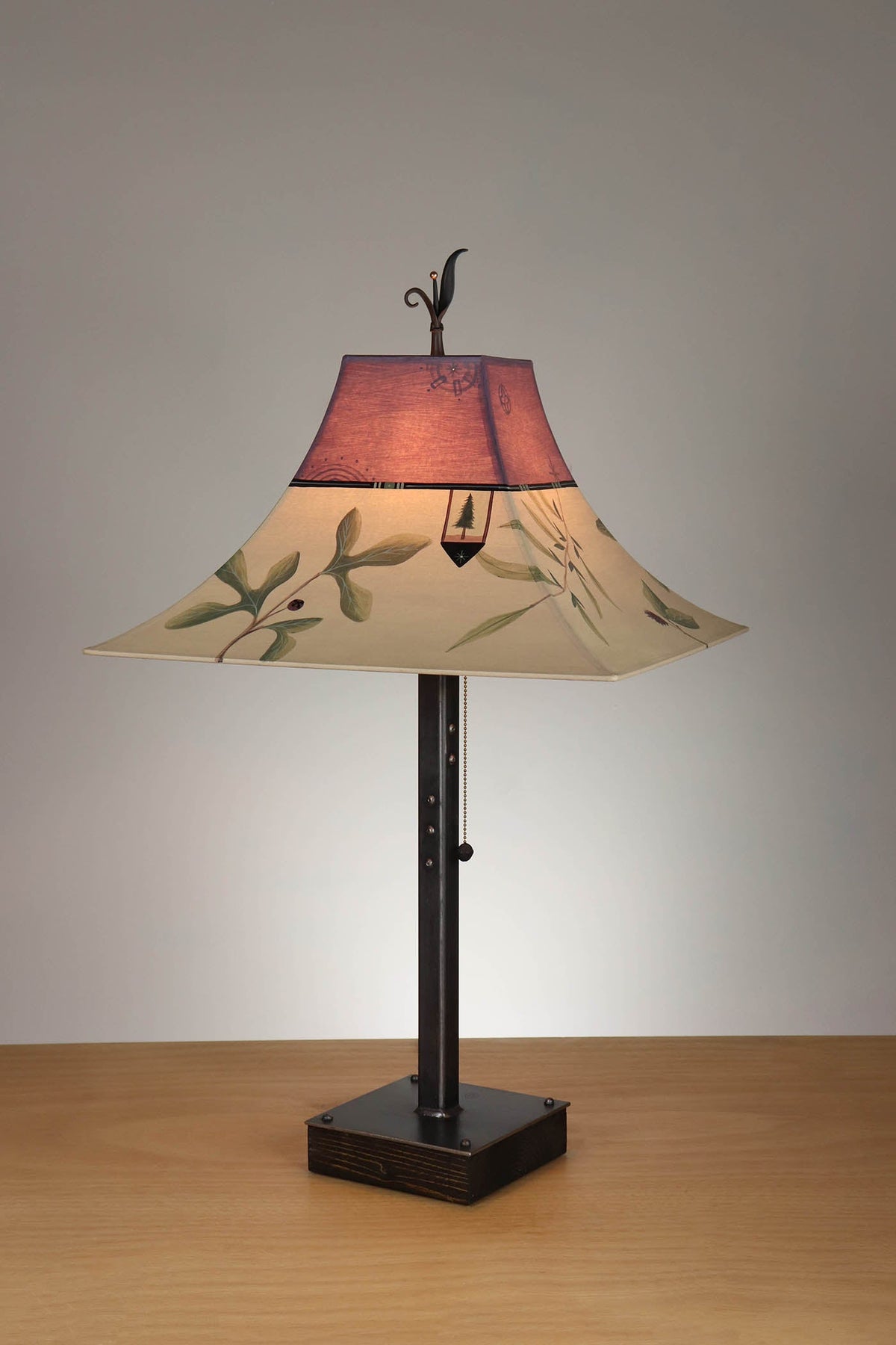 Janna Ugone &amp; Co Table Lamp Steel Table Lamp on Wood with Large Pagoda Shade in Mixed Leaves in Buff and Grape